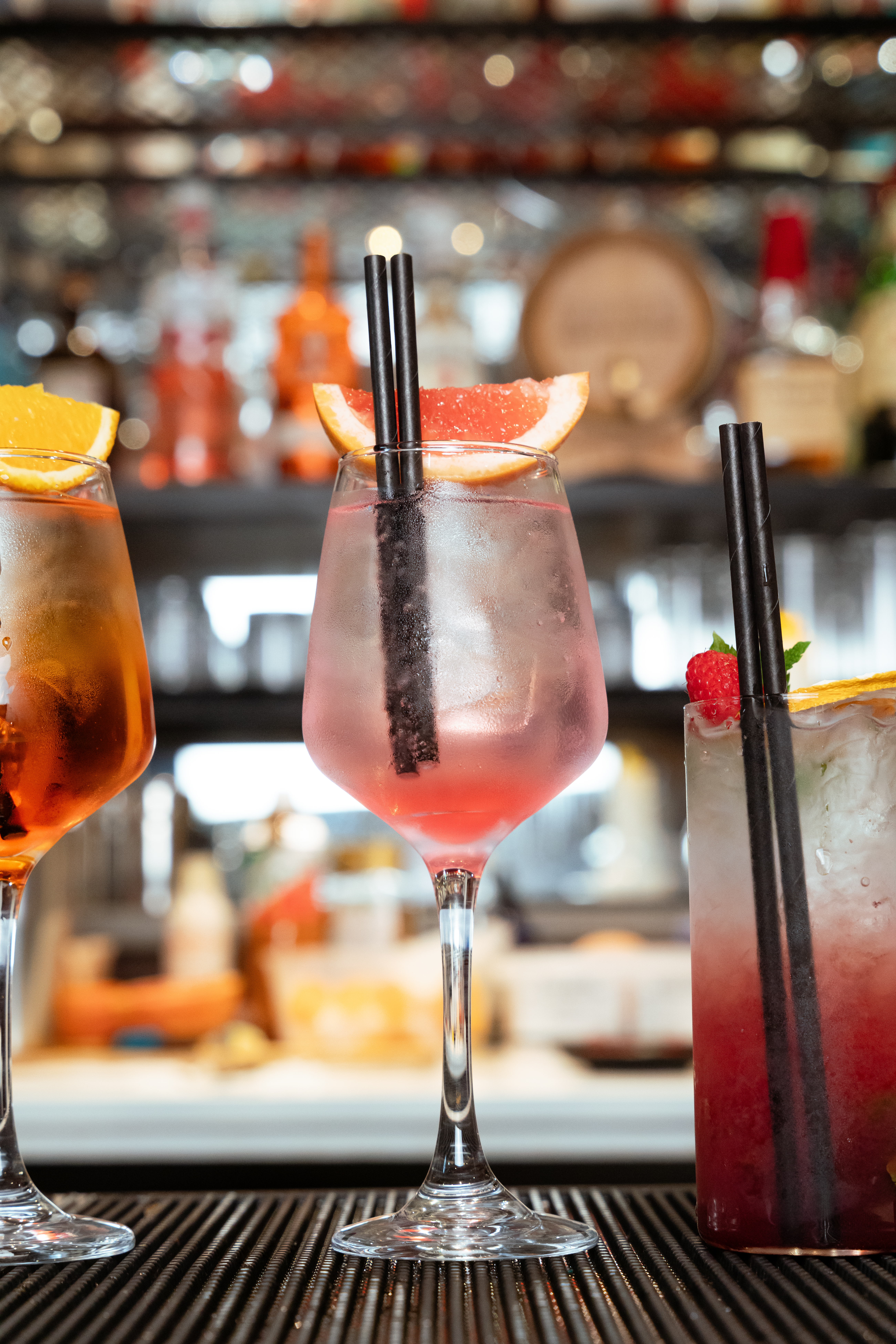 Pink spritz cocktail with other drinks at Mate's bar